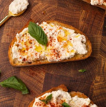 toast with vegan ricotta cheese, spices and fresh herbs