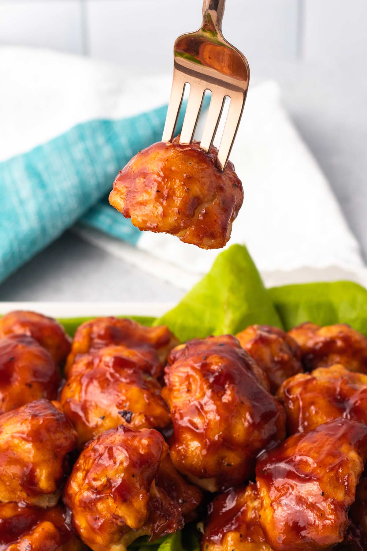 bowl of bbq cauliflower wings with shiny sauce