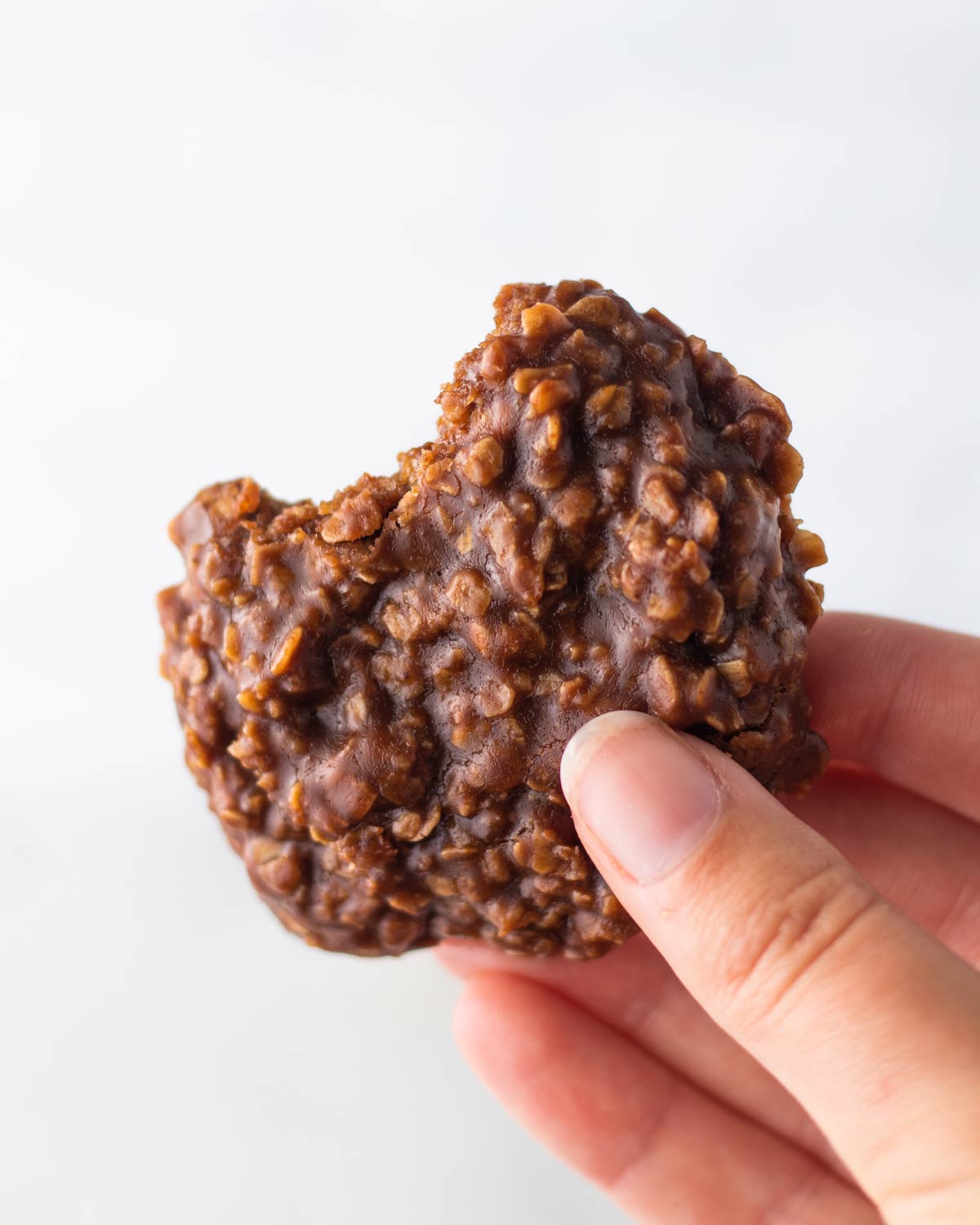hand holding a peanut butter chocoalte oat cookie